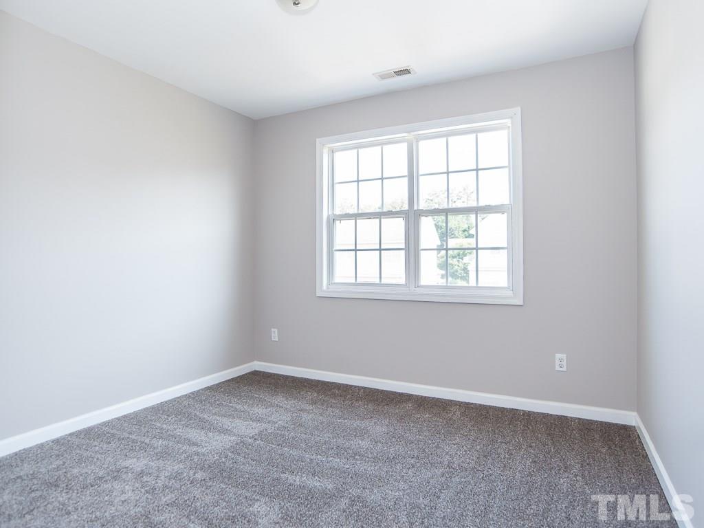 3824 Pin Oak Road Raleigh, NC 27604 - Photo 20 of 27 an empty room with a window