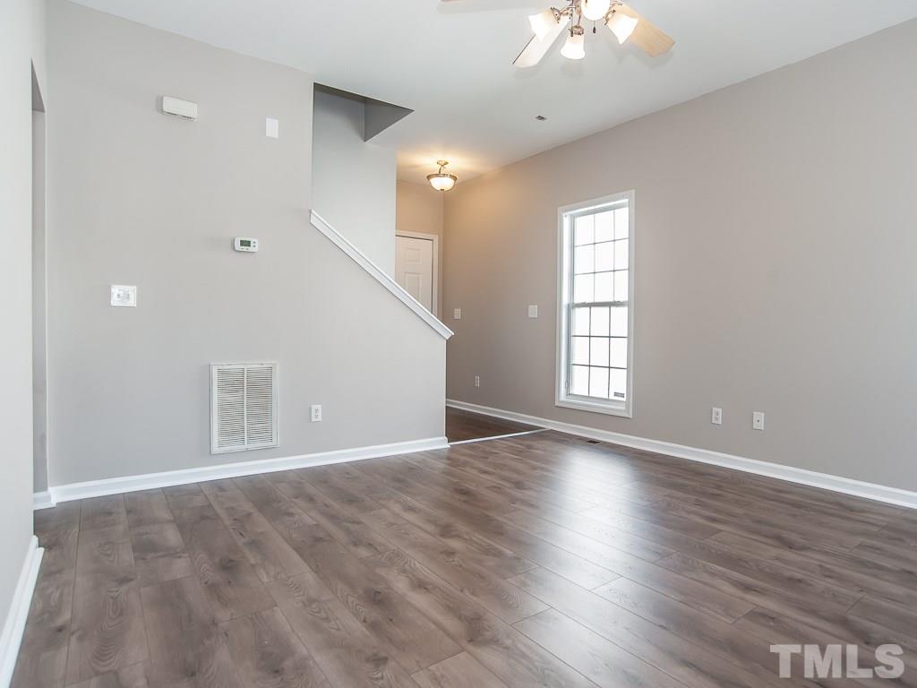 3824 Pin Oak Road Raleigh, NC 27604 - Photo 6 of 27 wooden floor in an empty room with a window