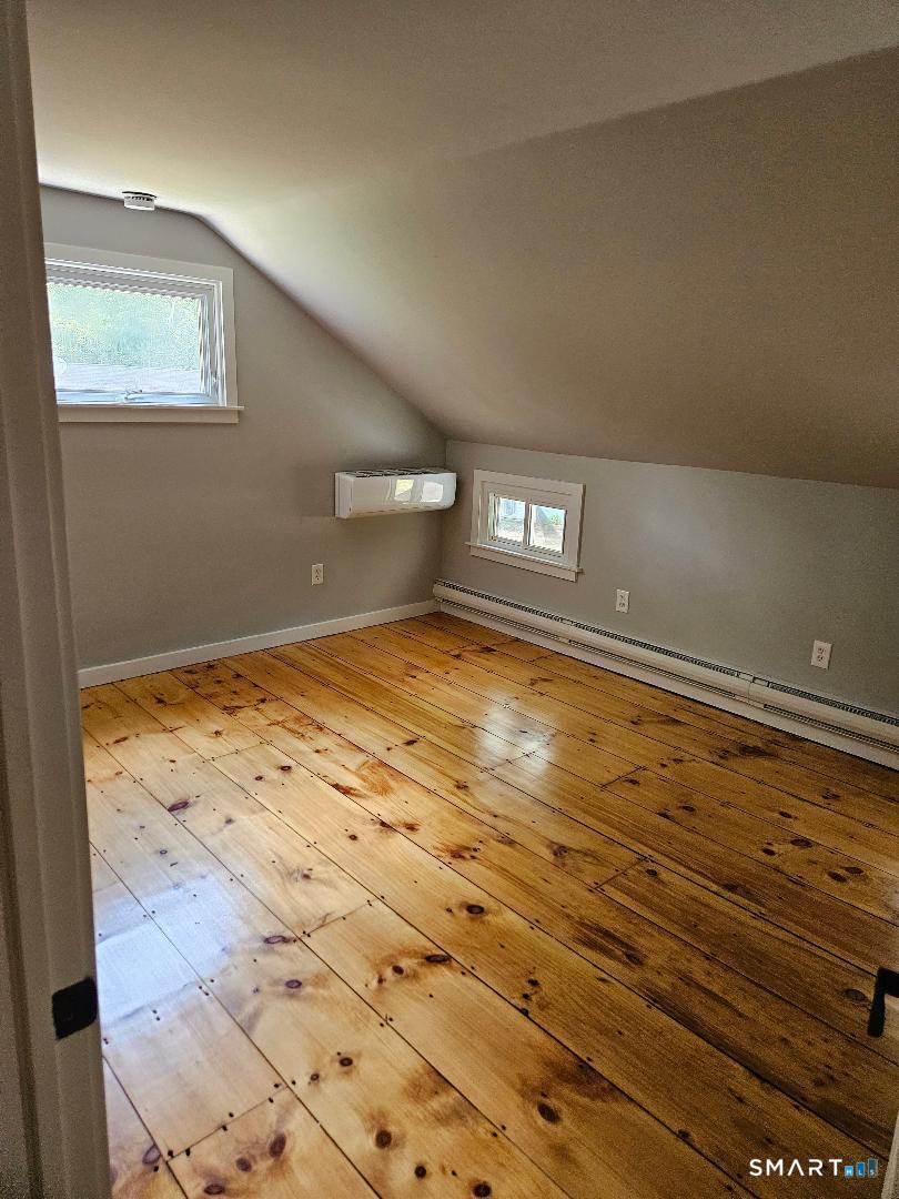 300 Railtree Hill Road Woodbury, CT 06798 - Photo 6 of 7 a view of empty room with wooden floor