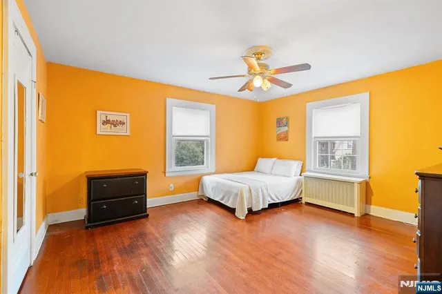 a spacious bedroom with a bed and a window