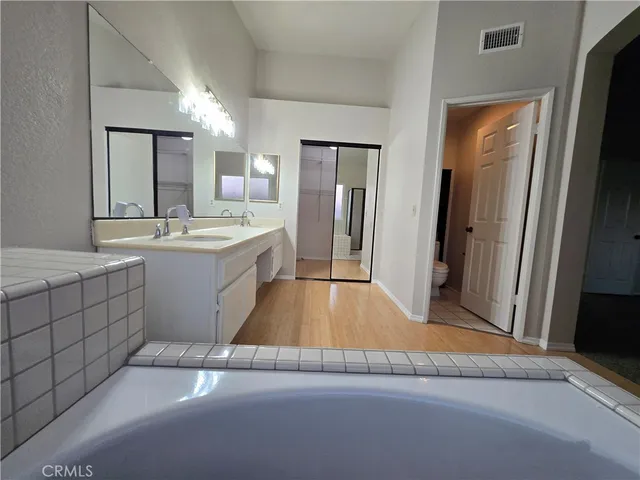 a bathroom with a sink and mirror