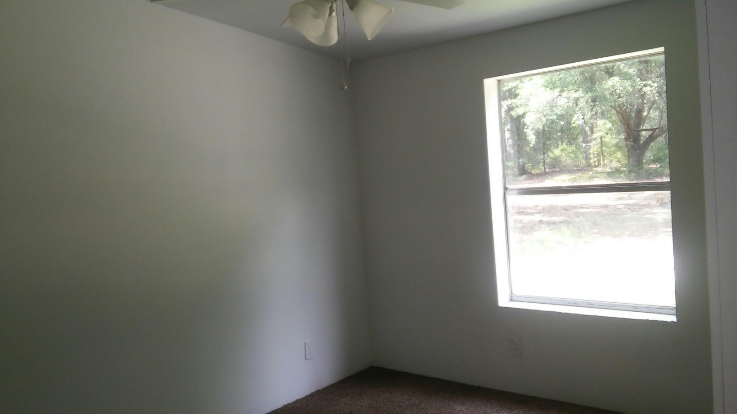 4353 Richardson Road Crestview, FL 32539 - Photo 11 of 15 a view of an empty room and window