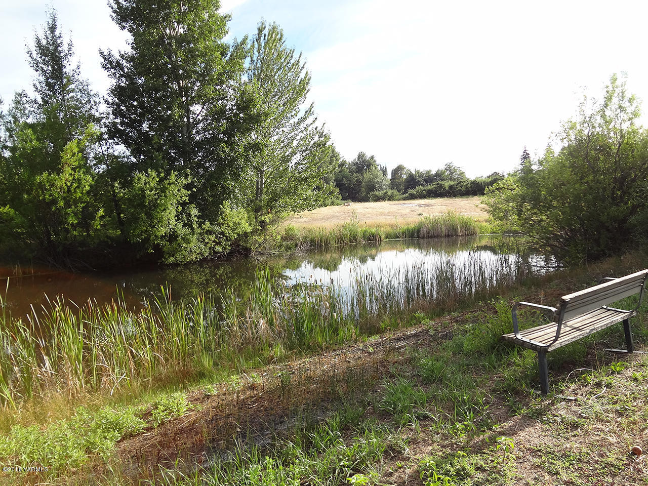 Nka Cook Road, Unit LOT #2 Yakima, WA 98908 - Photo 5 of 7 a view of a lake in between two chairs