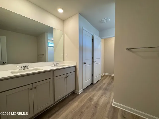 a bathroom with a glass shower door