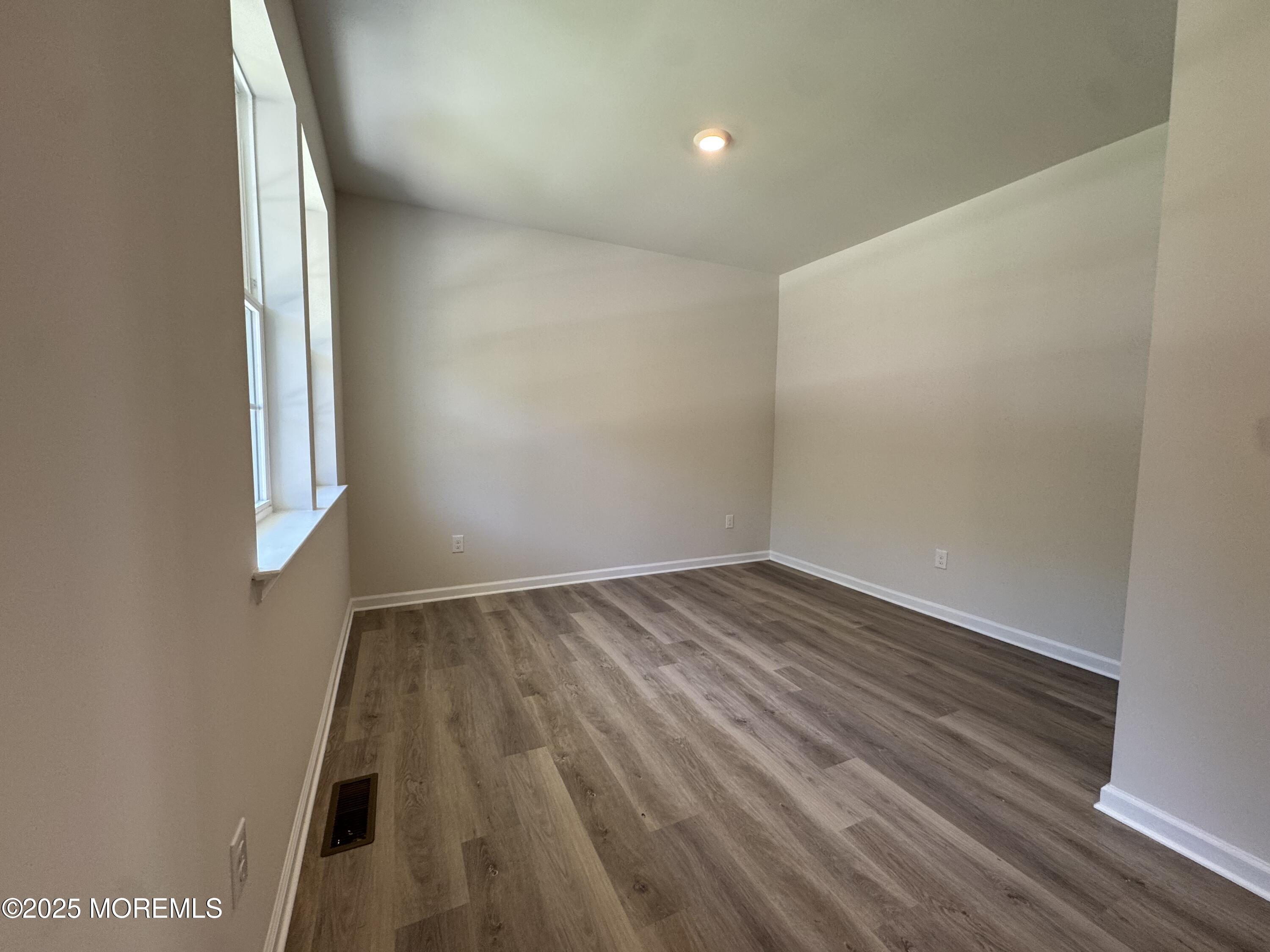 17 Whaler Avenue Barnegat, NJ 08005 - Photo 4 of 21 a view of an empty room and wooden floor