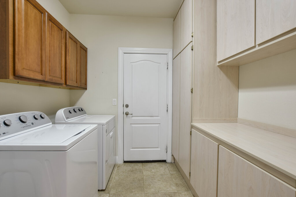 735 Breezeway Lane Georgetown, TX 78633 - Photo 15 of 33 Laundry area featuring an abundance of cabinet space.