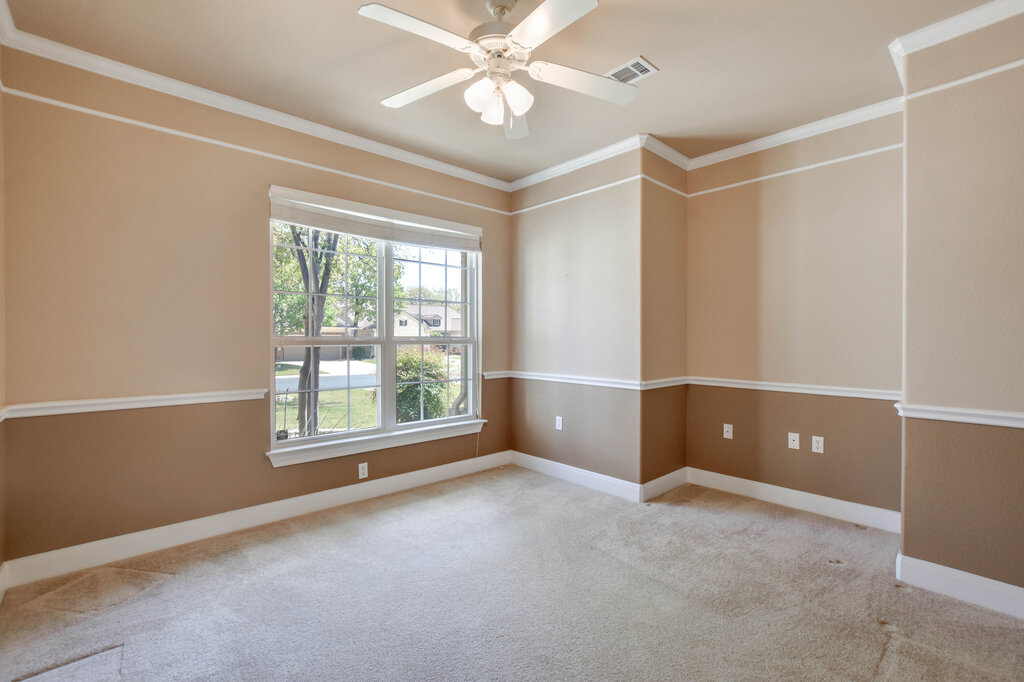 735 Breezeway Lane Georgetown, TX 78633 - Photo 17 of 33 Ceiling fan, carpet, and crown molding