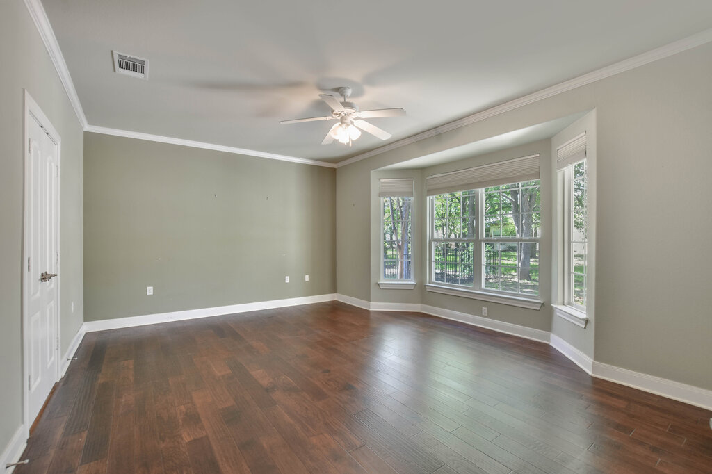 735 Breezeway Lane Georgetown, TX 78633 - Photo 19 of 33 Engineered wood style flooring, crown molding and a ceiling fan