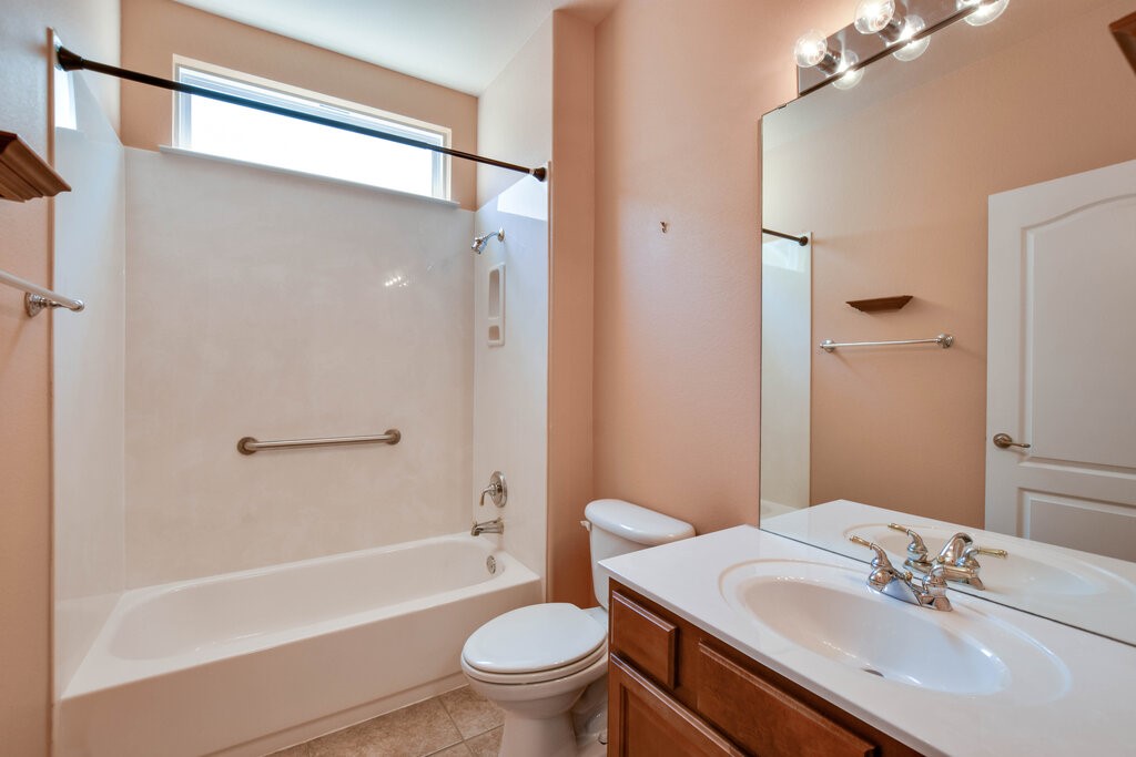 735 Breezeway Lane Georgetown, TX 78633 - Photo 27 of 33 Bathroom featuring vanity, bathtub / shower combination.
