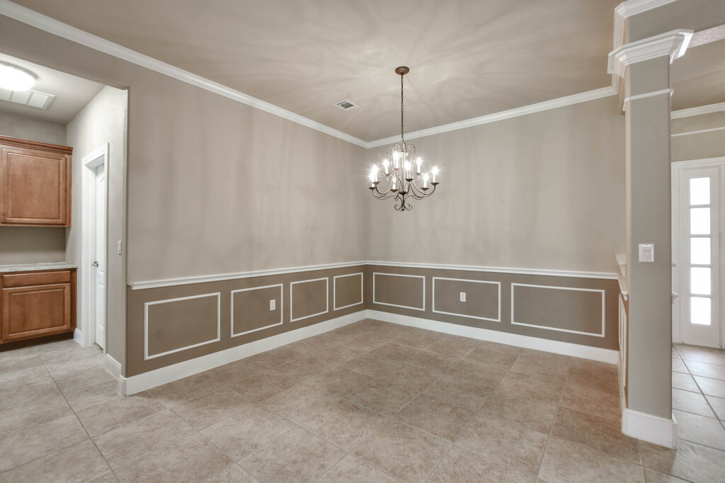735 Breezeway Lane Georgetown, TX 78633 - Photo 8 of 33 Formal Dining area with a two-toned paint and crown molding.