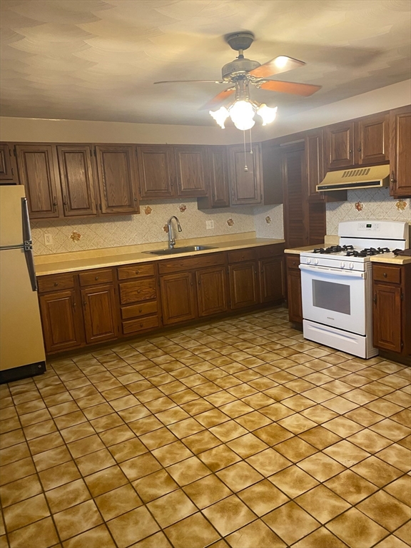 237 Lexington Street, Unit 3 Boston, MA 02128 - Photo 12 of 13 a kitchen with stainless steel appliances granite countertop a sink and cabinets