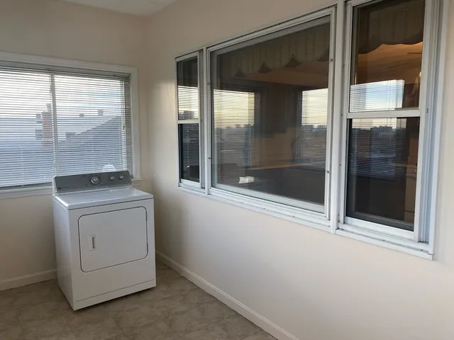 a kitchen with stainless steel appliances granite countertop a sink a stove a refrigerator and cabinets