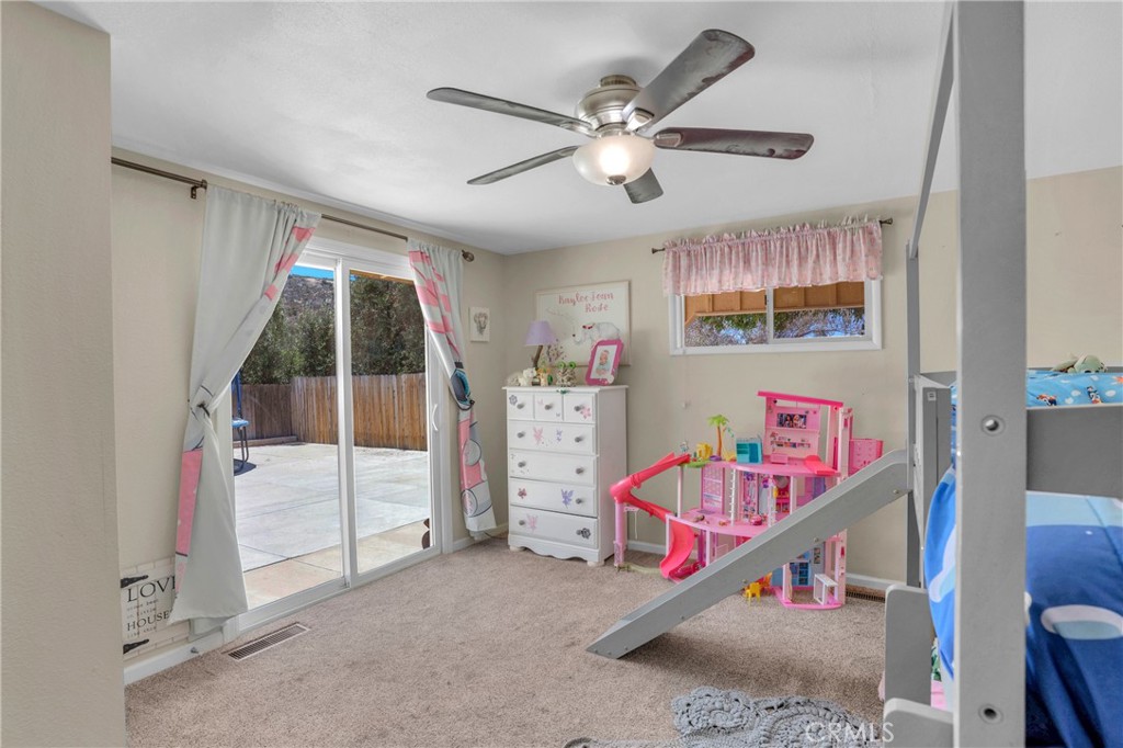 41257 Crest Drive Hemet, CA 92544 - Photo 27 of 53 Second bedroom with a slider leading to rear yard.