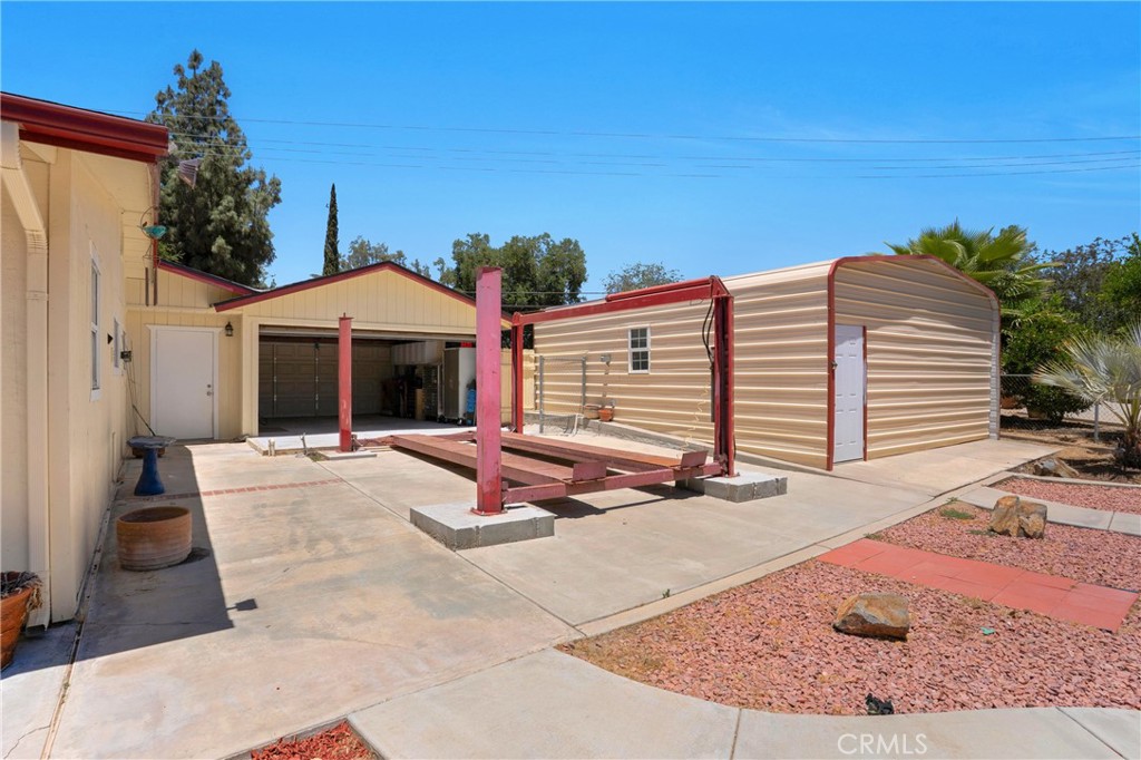 41257 Crest Drive Hemet, CA 92544 - Photo 38 of 53 Pull through garage/ Car lift and metal shop.