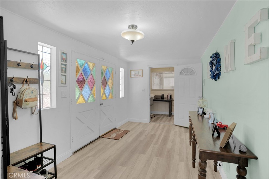 41257 Crest Drive Hemet, CA 92544 - Photo 6 of 53 entryway to family room and a separate home office. new laminate plank flooring