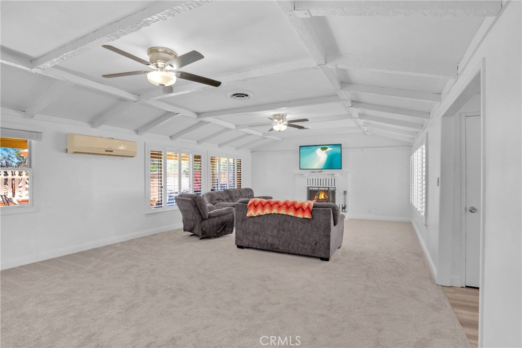 41257 Crest Drive Hemet, CA 92544 - Photo 7 of 53 Perfect family room for relaxed gatherings or quiet evenings by the fire. new carpeting.