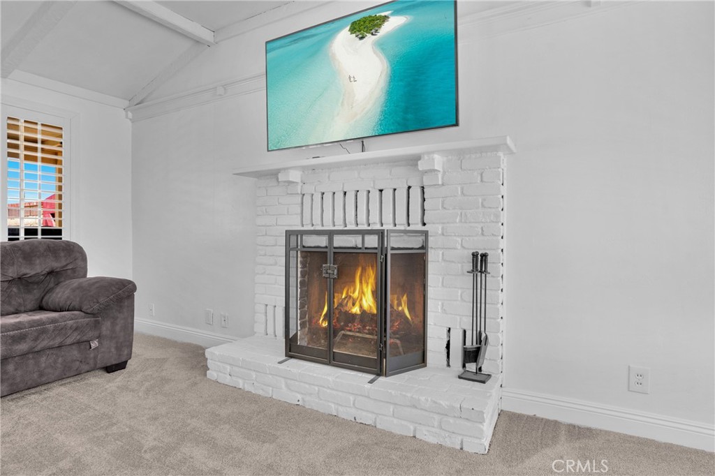 41257 Crest Drive Hemet, CA 92544 - Photo 9 of 53 A cozy fireplace anchors the space.