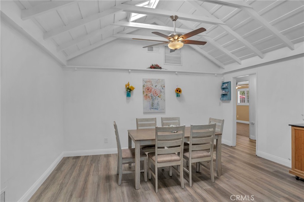 41257 Crest Drive Hemet, CA 92544 - Photo 10 of 53 dining room open to the kitchen. New laminate plank flooring.