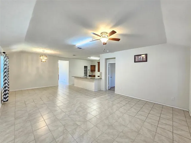 a view of a hallway with a kitchen