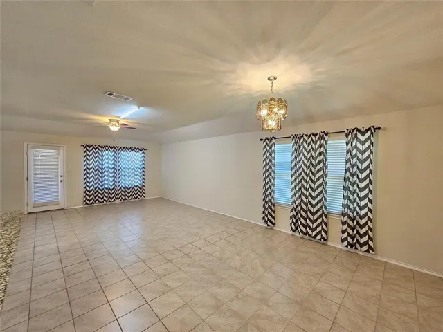 a kitchen with stainless steel appliances kitchen island granite countertop a sink and cabinets