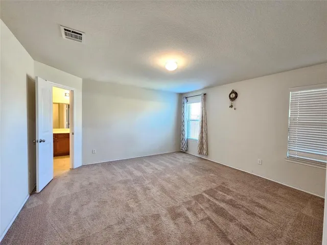 a large bathroom with a sink and a mirror