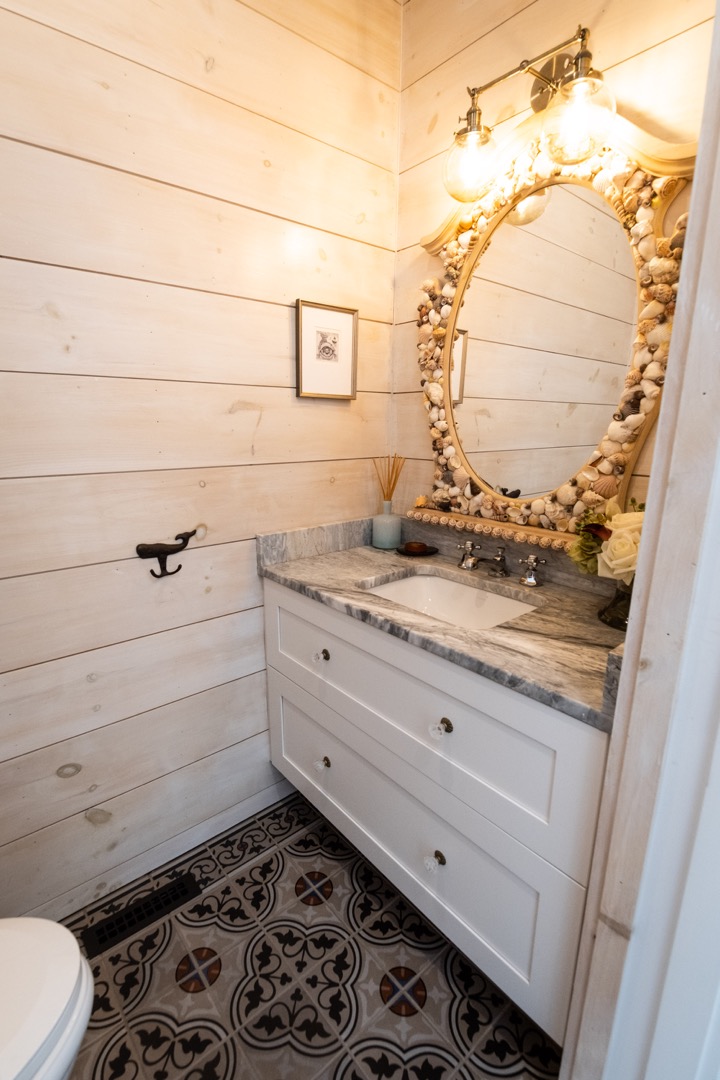 33.5 Vesper Lane Nantucket, MA 02554 - Photo 11 of 55 a bathroom with a granite countertop sink and a mirror