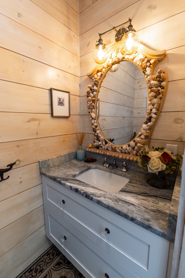 33.5 Vesper Lane Nantucket, MA 02554 - Photo 16 of 55 a bathroom with a granite countertop sink and a mirror
