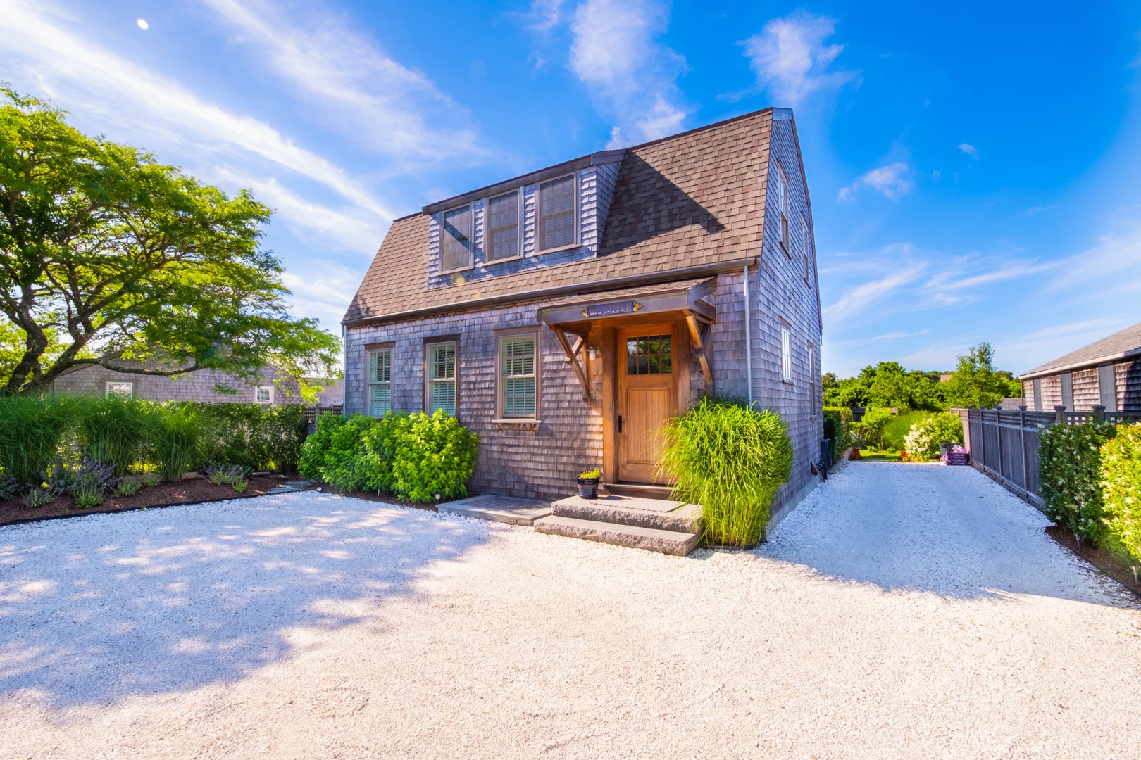 33.5 Vesper Lane Nantucket, MA 02554 - Photo 2 of 55 a front view of a house with garden