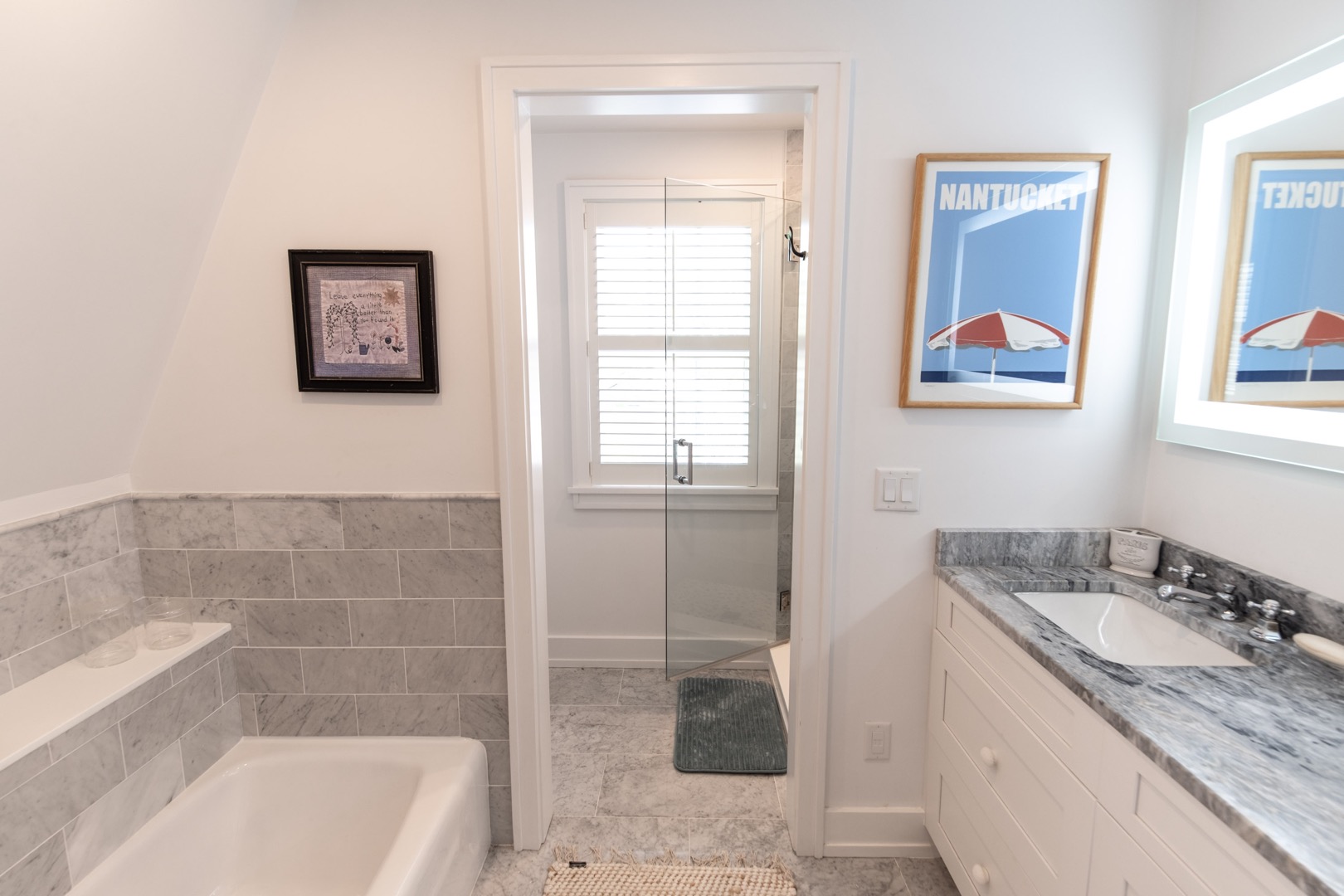 33.5 Vesper Lane Nantucket, MA 02554 - Photo 31 of 55 a bathroom with a granite countertop sink mirror and bathtub