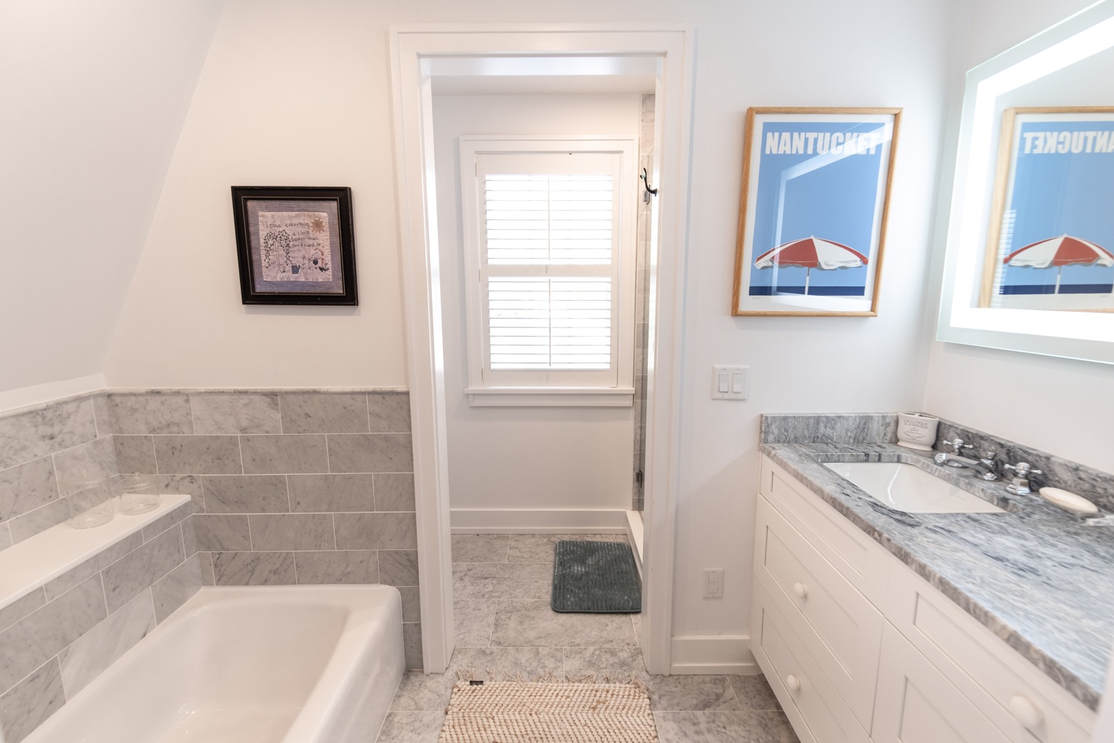 33.5 Vesper Lane Nantucket, MA 02554 - Photo 33 of 55 a bathroom with a granite countertop tub a sink and a window