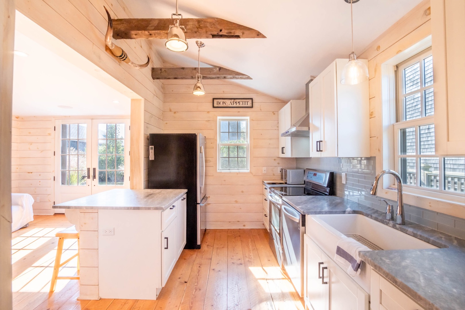 33.5 Vesper Lane Nantucket, MA 02554 - Photo 42 of 55 a large kitchen with granite countertop a sink a counter space and stainless steel appliances