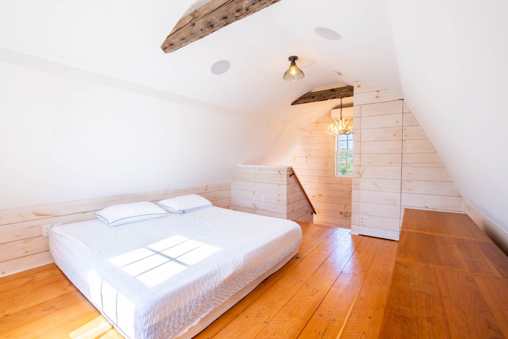 33.5 Vesper Lane Nantucket, MA 02554 - Photo 52 of 55 a bedroom with a bed and wooden floor