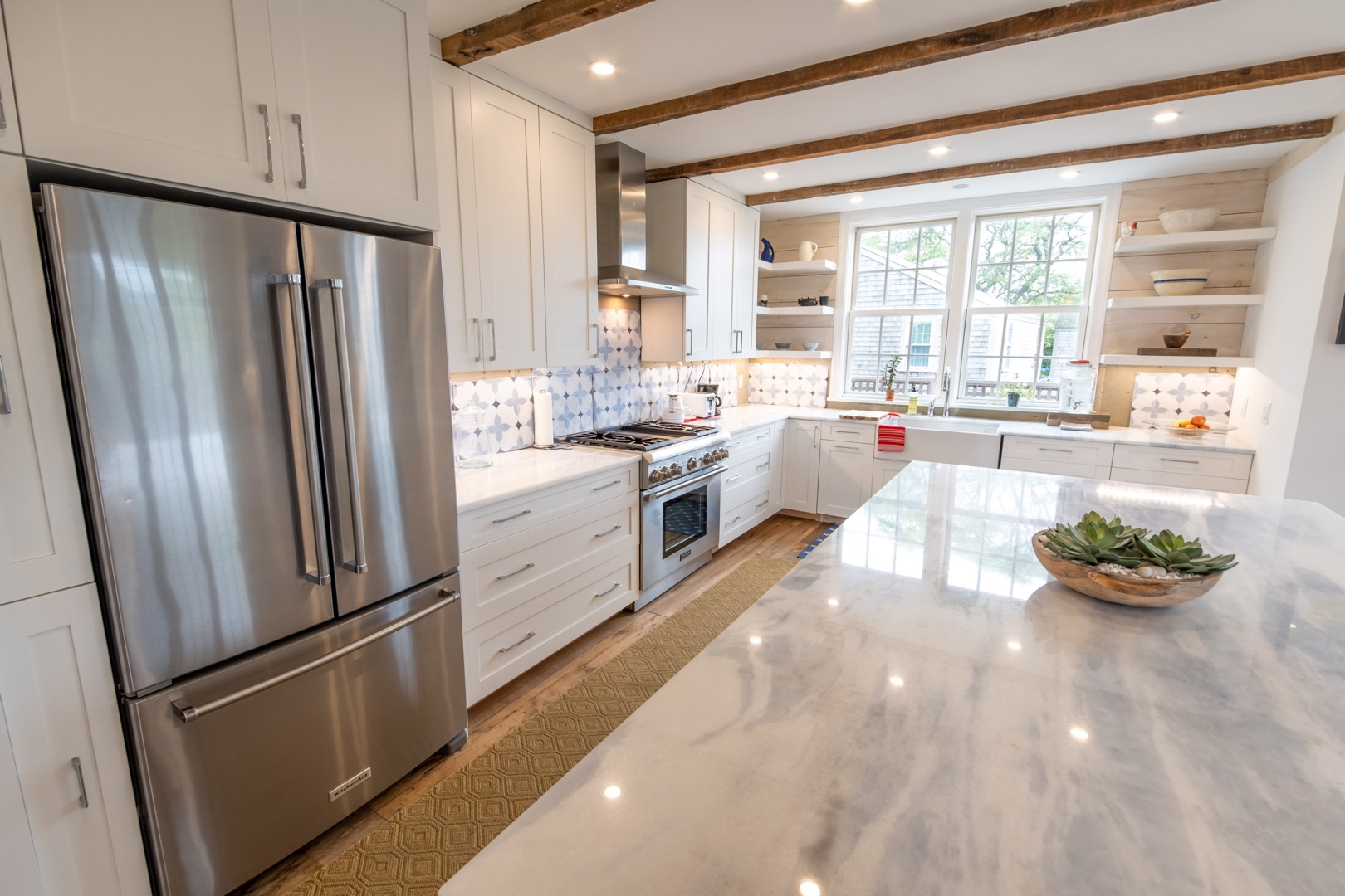33.5 Vesper Lane Nantucket, MA 02554 - Photo 9 of 55 a large kitchen with stainless steel appliances a large window and a refrigerator