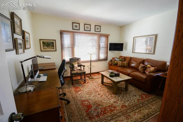 a living room with furniture and a window