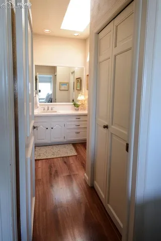 a bathroom with a vanity and a mirror