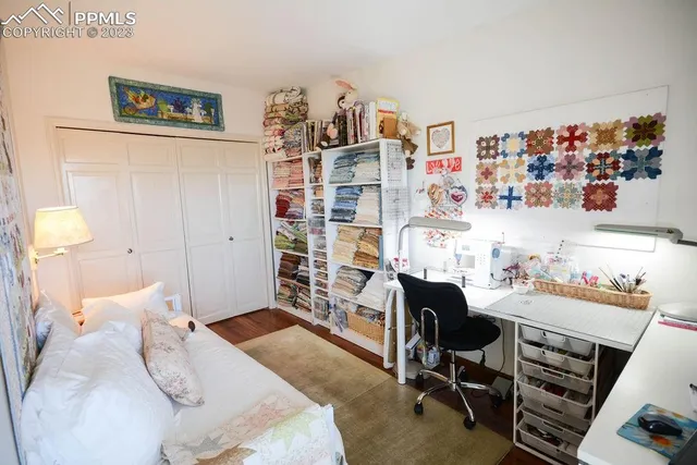 a bedroom with a workspace