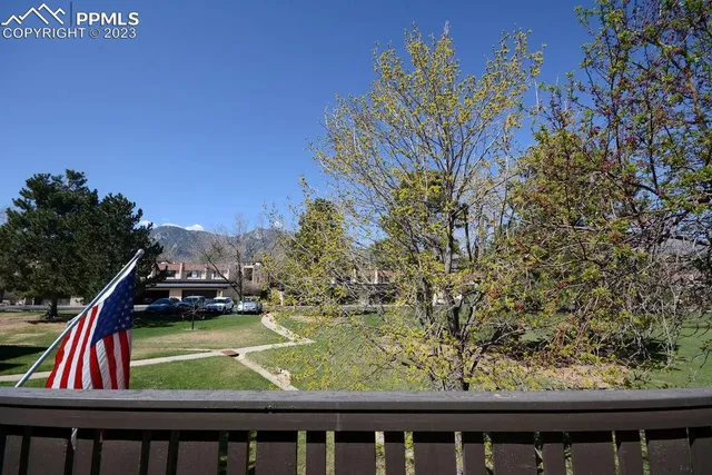 a view of backyard with a small pool