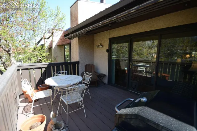 a table and chairs in front of a house