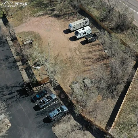 an aerial view of a house with outdoor space