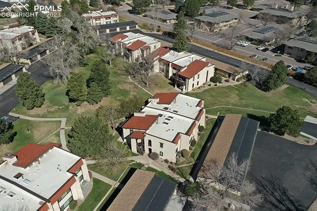 an aerial view of residential house and green space