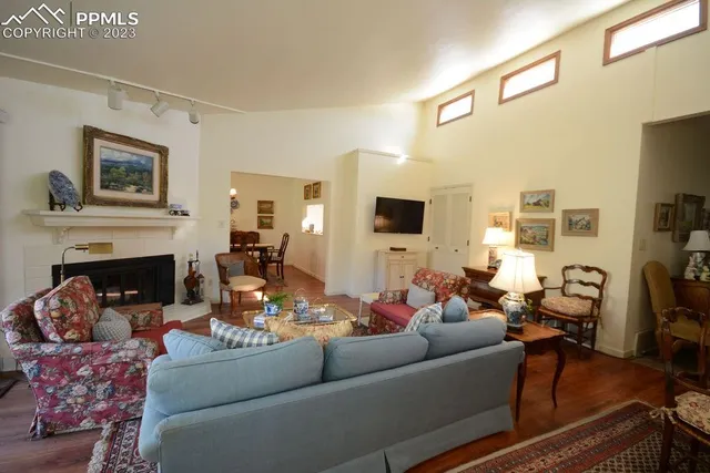 a living room with furniture fireplace and flat screen tv