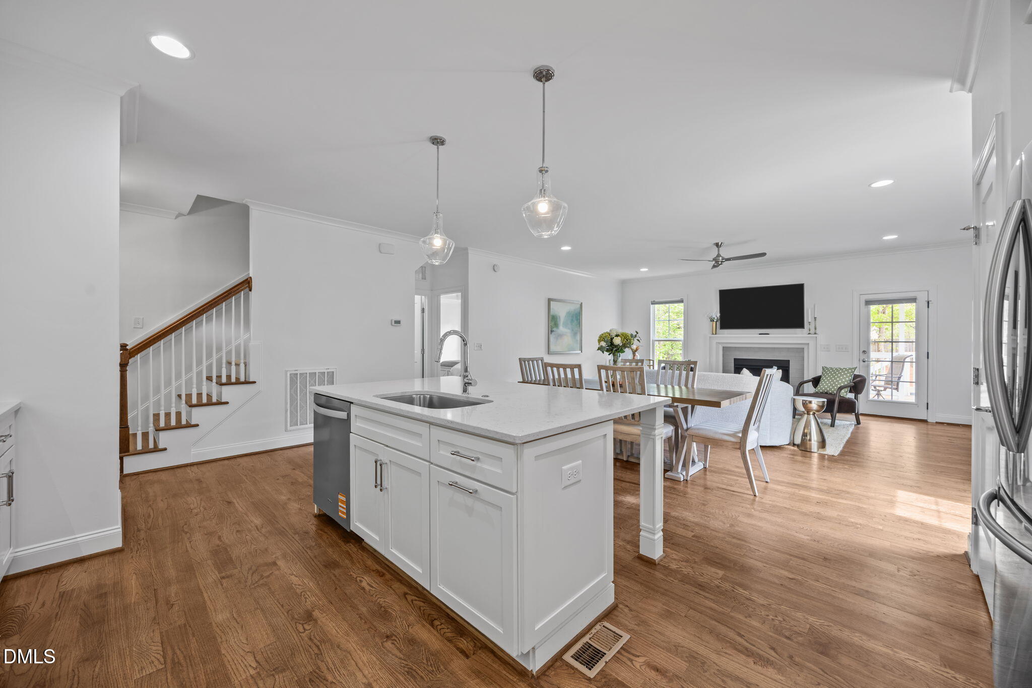 804 Hartford Road Raleigh, NC 27610 - Photo 4 of 26 a kitchen with stainless steel appliances granite countertop a stove and a wooden floors