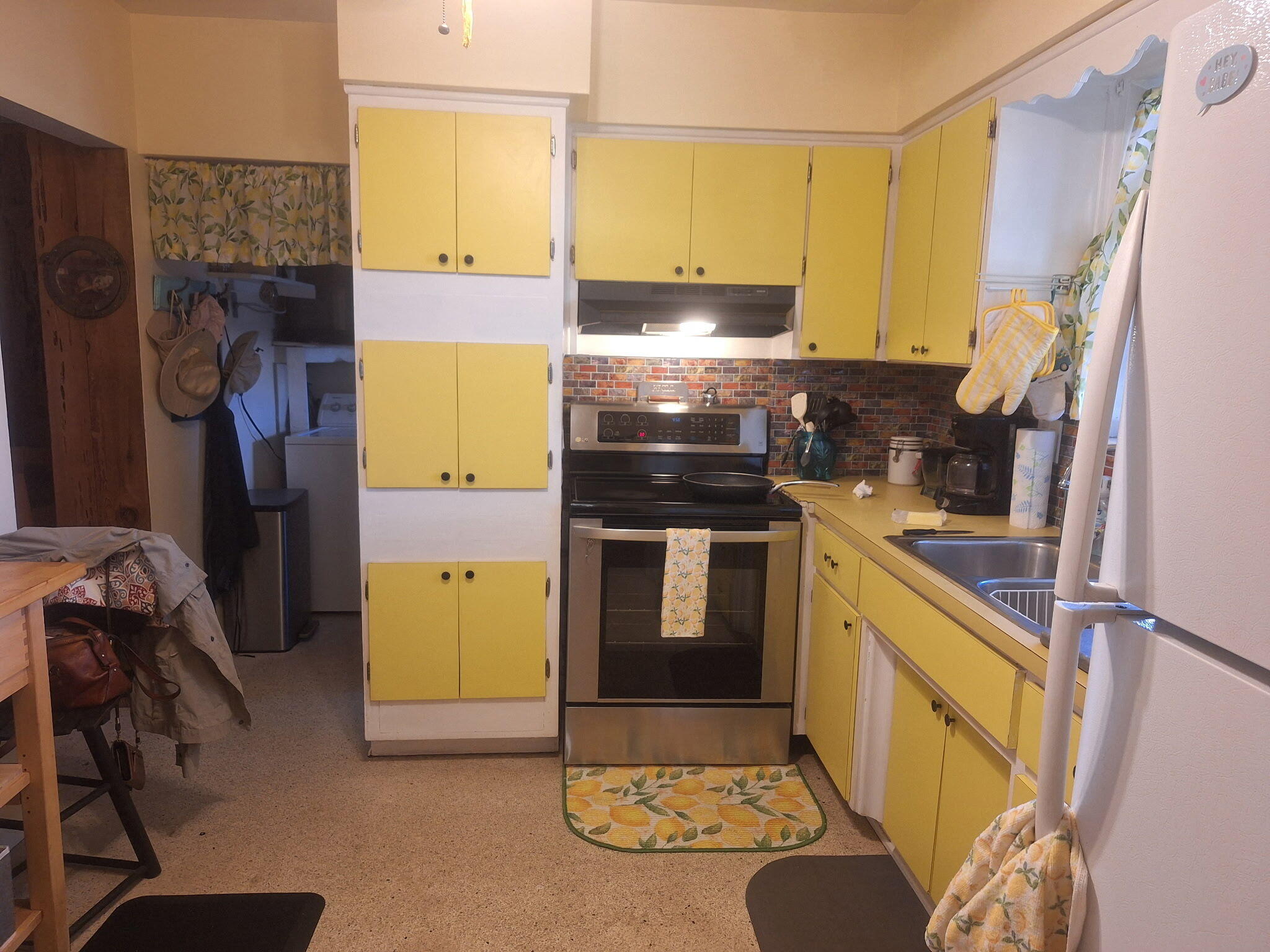 4820 Southwest 11th Street Plantation, FL 33317 - Photo 2 of 14 a kitchen with a sink stove and refrigerator