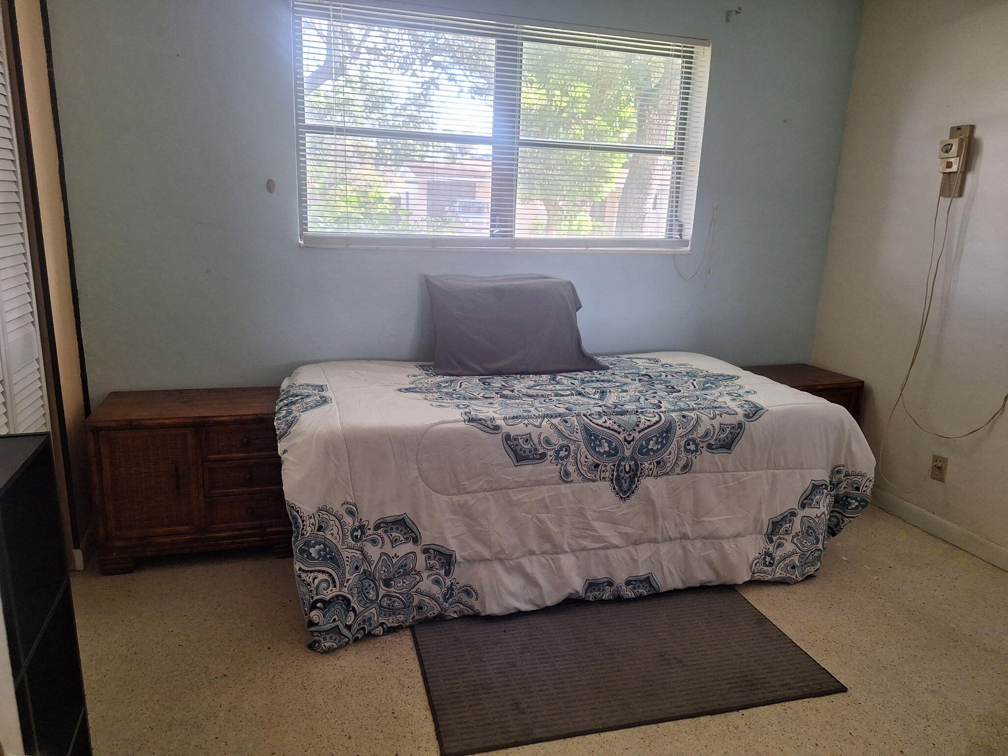4820 Southwest 11th Street Plantation, FL 33317 - Photo 10 of 14 a bed sitting in a bedroom next to a window
