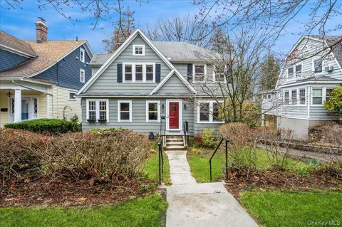 front view of a house with a yard