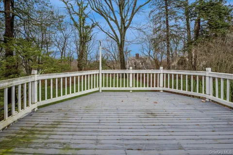 a view of backyard with large trees