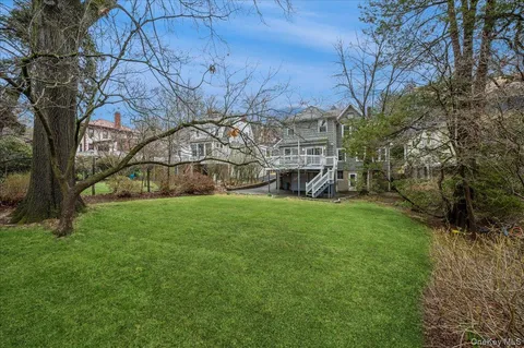 a view of a yard with a tree
