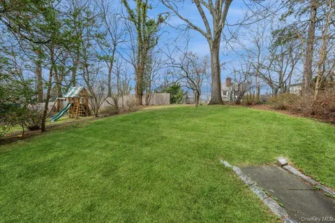 a bedroom with bed and window