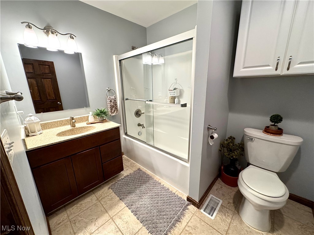 3450 Secrest Road Wooster, OH 44691 - Photo 29 of 34 Bathroom with vanity, toilet, and shower
