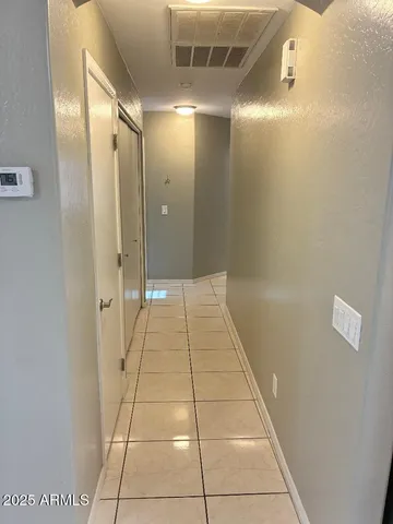 a bathroom with a glass door shower